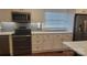 Features the stylish cabinetry, stainless appliances, marble countertops, and a blue subway tile backsplash at 8282 Park Edwards Rd, Kannapolis, NC 28081