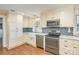The kitchen has stainless steel appliances, marble countertops, blue subway tile, and ample storage at 8282 Park Edwards Rd, Kannapolis, NC 28081