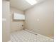 Functional laundry room with tile floors and hookups at 8282 Park Edwards Rd, Kannapolis, NC 28081