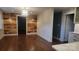 Modern living room featuring hardwood floors, shiplap accent walls, and updated lighting fixtures at 8282 Park Edwards Rd, Kannapolis, NC 28081
