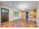 Inviting living room with hardwood floors, shiplap walls, and a large window, offering natural light at 8282 Park Edwards Rd, Kannapolis, NC 28081