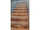 A stairway with wood treads, enhanced by integrated LED strip lights for an inviting ambiance at 8282 Park Edwards Rd, Kannapolis, NC 28081