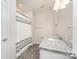 Well-lit bathroom features a granite countertop vanity, shower with curtain, and wood-look flooring at 829 River Park Rd, Belmont, NC 28012