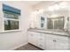 Bathroom with double vanity, granite countertop, and large mirror offers a luxurious feel at 829 River Park Rd, Belmont, NC 28012