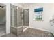 Modern bathroom featuring a glass-enclosed shower with stylish tile and a bright window at 829 River Park Rd, Belmont, NC 28012