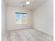 Bedroom featuring neutral carpet, a window and a ceiling fan at 829 River Park Rd, Belmont, NC 28012