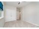 Bright and spacious bedroom with plush carpeting, closet with doors, neutral walls, and overhead lighting at 829 River Park Rd, Belmont, NC 28012