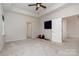 Spacious bedroom featuring plush carpet, ceiling fan, and ample natural light at 829 River Park Rd, Belmont, NC 28012