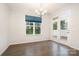 Dining room area featuring hardwood floors, modern lighting and glass patio doors at 829 River Park Rd, Belmont, NC 28012