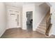Bright foyer with hardwood floors, a staircase with wooden banister, and a view into the office at 829 River Park Rd, Belmont, NC 28012