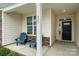 Inviting front porch featuring blue Adirondack chairs and a view of the house number, 829 at 829 River Park Rd, Belmont, NC 28012