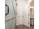 Hallway featuring a decorative sliding barn door and access to a pedestal sink bathroom at 829 River Park Rd, Belmont, NC 28012