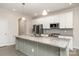 Modern kitchen with a spacious island, granite countertops, and stainless steel appliances at 829 River Park Rd, Belmont, NC 28012