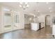 Open concept kitchen with granite island and access to dining and living areas at 829 River Park Rd, Belmont, NC 28012