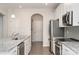 Modern kitchen with stainless steel appliances, granite countertops, and ample cabinet space at 829 River Park Rd, Belmont, NC 28012