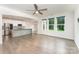 Spacious living area with hardwood floors, a ceiling fan, and large windows offering great natural lighting at 829 River Park Rd, Belmont, NC 28012