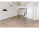 Bright, open living room features hardwood floors and a ceiling fan, showcasing a modern and airy space at 829 River Park Rd, Belmont, NC 28012