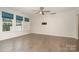 Bright, airy living room featuring hardwood floors and large windows for natural light at 829 River Park Rd, Belmont, NC 28012