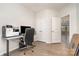 Bright office space features modern desk, storage, and open doorway to adjoining room at 829 River Park Rd, Belmont, NC 28012