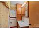 Cozy bathroom with a vanity, storage cabinet, and natural light at 1000 Peachtree Rd, Charlotte, NC 28216