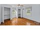 Bright bedroom features hardwood floors, two closets, and natural light at 1000 Peachtree Rd, Charlotte, NC 28216