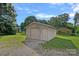 Exterior view of a detached one-car garage with a gabled roof at 1000 Peachtree Rd, Charlotte, NC 28216