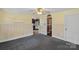 Open-concept living area showing the transition into the kitchen at 1000 Peachtree Rd, Charlotte, NC 28216