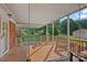 Relaxing covered porch features a swing and spacious deck at 1000 Peachtree Rd, Charlotte, NC 28216