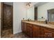 Elegant bathroom features a granite countertop, double sinks, and a beautifully tiled walk-in shower at 10502 Old Ardrey Kell Rd, Charlotte, NC 28277