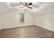 Bedroom featuring a ceiling fan, vaulted ceiling, and natural light at 10502 Old Ardrey Kell Rd, Charlotte, NC 28277