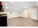Spacious bonus room with vinyl flooring and adjacent kitchenette area perfect for entertaining at 10502 Old Ardrey Kell Rd, Charlotte, NC 28277