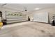 Spacious garage with storage cabinets, bright natural light, and high ceilings at 10502 Old Ardrey Kell Rd, Charlotte, NC 28277