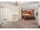 Open-concept kitchen boasts a large island with seating, stainless appliances, and seamless flow to the dining area at 10502 Old Ardrey Kell Rd, Charlotte, NC 28277