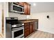 Kitchenette featuring stainless steel appliances and granite countertops at 10502 Old Ardrey Kell Rd, Charlotte, NC 28277