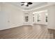 Bright living room with modern floors, large windows, and an open layout perfect for entertaining at 10502 Old Ardrey Kell Rd, Charlotte, NC 28277