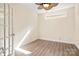 Cozy home office space with natural light, modern flooring, and a ceiling fan at 10502 Old Ardrey Kell Rd, Charlotte, NC 28277
