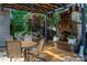 Stone outdoor fireplace with artistic detail, overlooking a private backyard garden at 10502 Old Ardrey Kell Rd, Charlotte, NC 28277