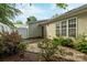Backyard features a white fence, stone details, and lush greenery at 112 Dujon Ct, Mount Holly, NC 28120