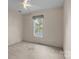 Neutral bedroom with a window and carpet flooring; the room is empty and ready to be furnished at 112 Dujon Ct, Mount Holly, NC 28120