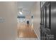 Inviting home foyer with hardwood floors, fireplace, and abundant natural light from a skylight at 112 Dujon Ct, Mount Holly, NC 28120