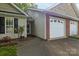 Charming single-story home featuring a two-car garage and well-maintained landscaping at 112 Dujon Ct, Mount Holly, NC 28120