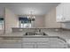 Spacious kitchen featuring a stainless steel sink, a dishwasher and sight lines to the dining room at 112 Dujon Ct, Mount Holly, NC 28120