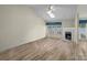 Spacious living room with a fireplace and large windows that let in plenty of natural light at 112 Dujon Ct, Mount Holly, NC 28120
