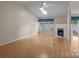 Spacious living room with hardwood floors, fireplace, and a large window with lots of natural light at 112 Dujon Ct, Mount Holly, NC 28120