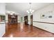 Spacious living room featuring hardwood floors, a fireplace, and natural light at 113 Helena St, Mount Holly, NC 28120