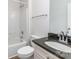 Bathroom featuring granite counters, white cabinets, and shower-tub combo at 11526 Mcginns Trace Ct, Charlotte, NC 28277