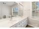 Bright bathroom featuring double vanity and large mirror providing ample lighting at 11526 Mcginns Trace Ct, Charlotte, NC 28277