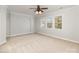 Spacious bedroom with archway detail, neutral carpet and three windows bringing in natural light at 11526 Mcginns Trace Ct, Charlotte, NC 28277