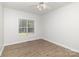Bedroom featuring wood flooring, a ceiling fan, and a window with blinds at 11526 Mcginns Trace Ct, Charlotte, NC 28277