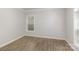 Bright and airy bedroom with neutral walls, hardwood floors, and ample natural light at 11526 Mcginns Trace Ct, Charlotte, NC 28277